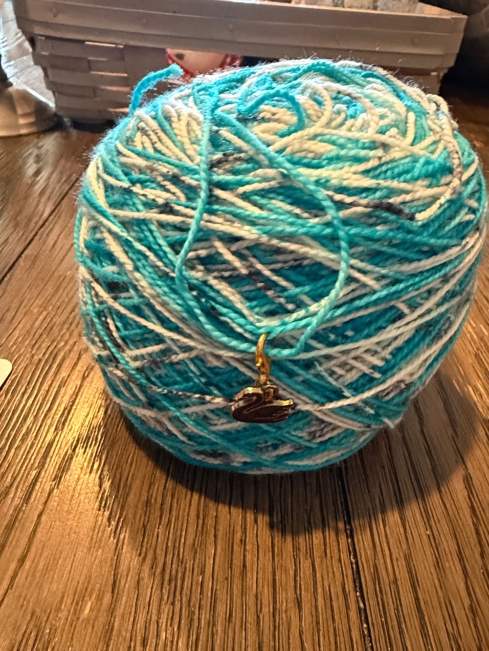Turquoise & White hand dyed Variegated Yarn Ball with Swan Charm